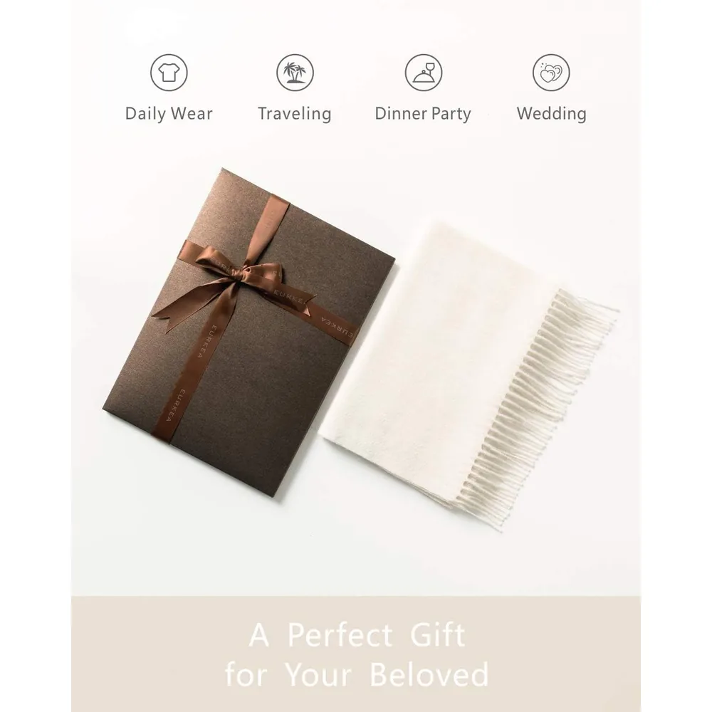 Ivory cashmere scarf next to its gift box